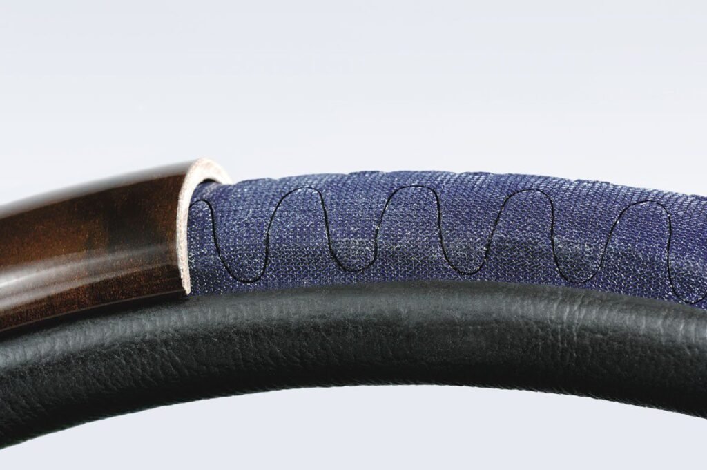 As a carrier material for steering wheel heating, the special foam INDUCON® makes the heating wire under the leather lining neither visible nor noticeable